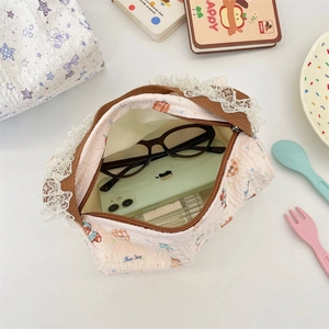 Quilted cream canvas handbag interior showing space for smartphone and glasses