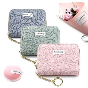 Floral embossed card holders in blue, green and pink with elegant gold chain links