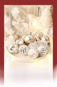 Detailed view of champagne gold and white Christmas balls with glitter and painted patterns