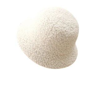 Winter white faux lamb wool bucket hat with textured knit fabric and minimalist style