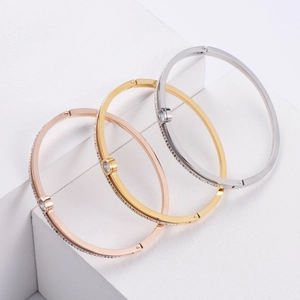 Three-piece hollowed cuff bracelet set in gold, rose gold, and silver with zircon accents