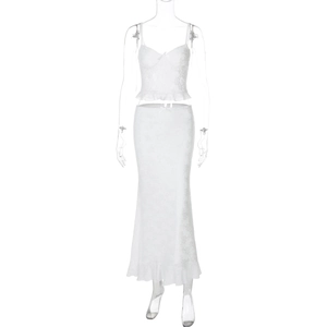 Detailed view of white lace two-piece set featuring ruffled trim camisole and bodycon skirt