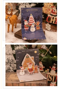 Detailed 3D pop-up Christmas card featuring Santa and gingerbread house designs