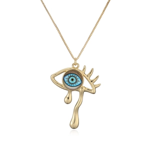 Retro gold necklace with blue enamel evil eye and teardrop pendant on white background