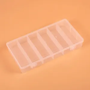 Detail view of 6-compartment transparent plastic storage box measuring 21x11x3.3cm