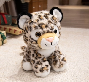 Close-up of realistic leopard cub plush with soft leopard print fur and vivid brown eyes