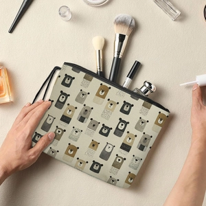 Handheld canvas cosmetic bag with cartoon bear pattern and black zipper for daily storage
