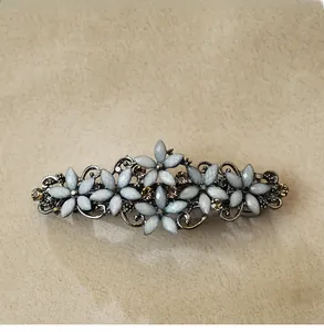 Vintage alloy spring hair clip with frosted flower petals and amber rhinestones