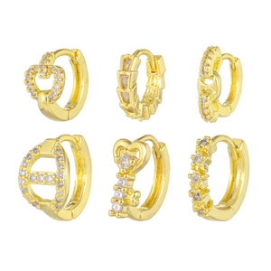 Set of six gold geometric hoop earrings with heart, key, and cubic zirconia designs