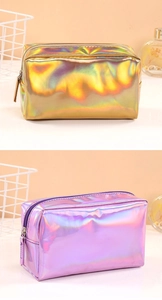 Macro shot of iridescent laser makeup bags in gold and purple with zipper closure details