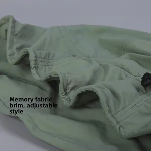 Close-up of shapeable brim memory wire on lightweight green sun hat for flexible styling