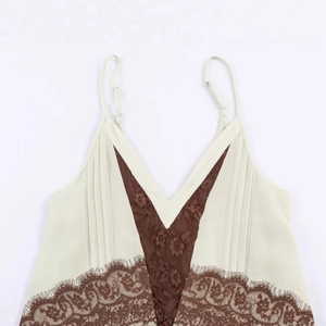 Women's off-white camisole top with dark brown lace trim and adjustable thin straps