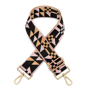 Adjustable wide replacement bag strap with pink and black geometric woven pattern and gold hooks