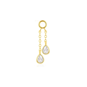 Detailed macro view of dual gold chain charms with clear teardrop-cut cubic zirconia gems