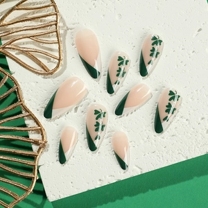French green St. Patrick's Day press on nails with clover patterns and almond shape
