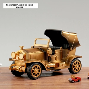 Detail of vintage gold musical car model with auto-drive and music playback functions
