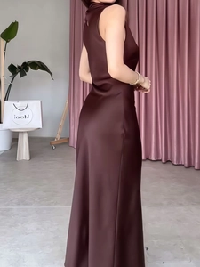 Elegant chocolate satin maxi dress with halter neckline and slim fit silhouette