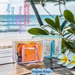 Detail of waterproof transparent PVC beach bag with pink handle and star print pattern