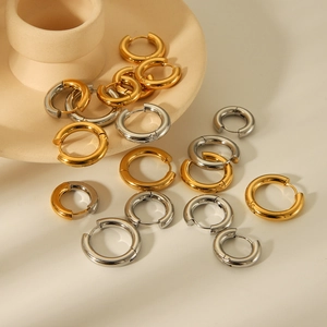 Polished titanium steel hoop earrings in gold and silver finishes with various sizes