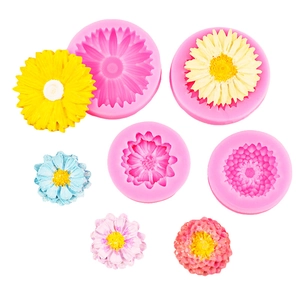 Pink sunflower and daisy silicone molds set with colorful floral fondant decorations