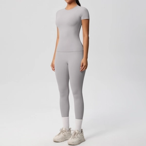 Detail of light grey seamless yoga set with high waist leggings and short sleeve top