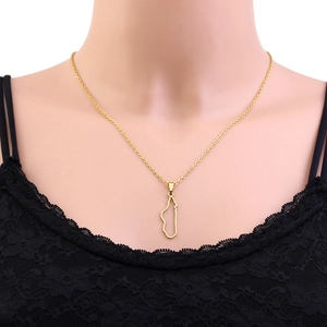 Detailed close-up of golden Madagascar map pendant necklace on a jewelry bust display