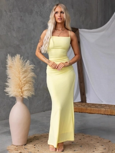 Sexy backless pale yellow maxi dress with cross straps and slim fit design for summer