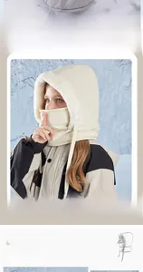 Close-up of children's fleece integrated neck warmer and earflap hat in beige faux fur