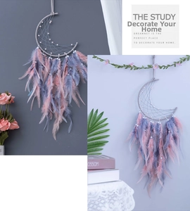 Detail view of crescent moon dreamcatcher with pink and blue feathers for home decor