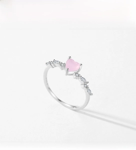 Detail of pink heart-shaped crystal ring with marquise cubic zirconia in S925 silver