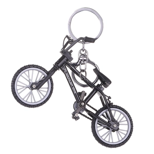 Miniature mountain bike keychain with realistic black frame and rotating wheels