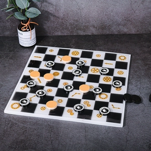 Top view of steampunk silicone chess mold featuring gear patterns and crown insignia