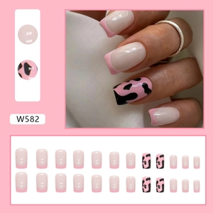 Pink French square press-on nails with black cow print patterns and 24-piece full set layout