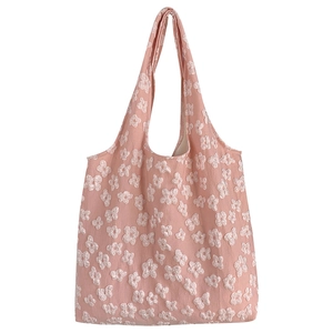 Pink canvas tote bag with white 3D flower embroidery and minimalist shoulder strap design