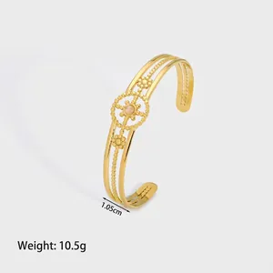 Detail showing 1.05cm gold hollow cuff bracelet with vintage floral bead design