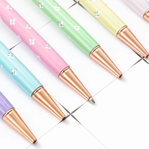 Five colorful rhinestone pens with pearl flower clips and rose gold metal finish accents
