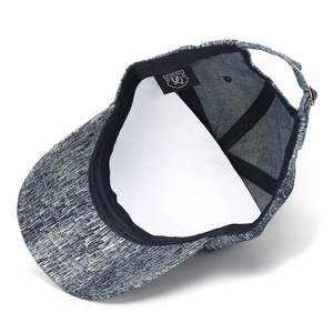 Close-up of the denim baseball cap inner lining and adjustable strap structure