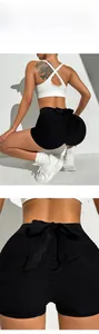 Detail of high-waist yoga shorts featuring honeycomb texture and back bow decoration
