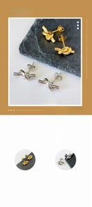 Detailed close-up of knotted stud earrings in polished gold and silver finishes