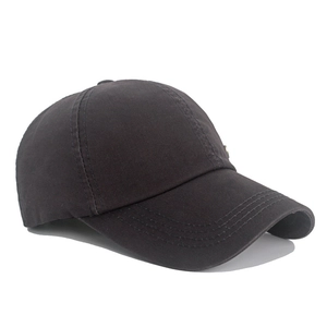 Detail of dark grey washed cotton baseball cap with ventilation eyelets and side metal stud