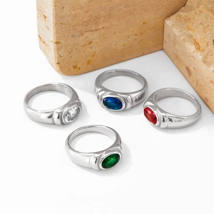 Vintage stainless steel ring set with oval colorful gemstones in red, green, and blue