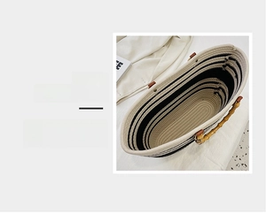Detailed view of the spacious inner compartment of the woven tote bag with bamboo handles