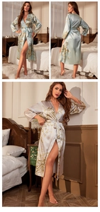 Detail of silk-feel robe featuring elegant gold floral patterns and waist tie