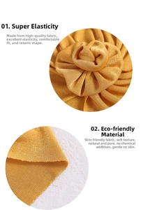 Detail of baby turban hat showing elastic ginger yellow fabric and 3D floral knot texture