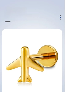 Macro detail of gold G23 titanium airplane stud earring with internal thread design