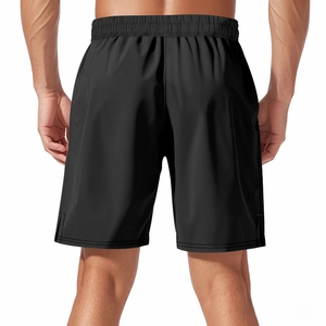 Rear view of black loose-fit quick-dry athletic shorts with elastic waist and side slit