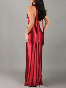 Detail of red satin backless dress featuring a cowl neck and elegant long neck streamers