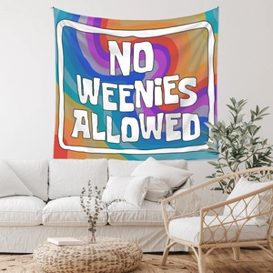 Detail of colorful spiral tapestry featuring No Weenies Allowed text in a modern room