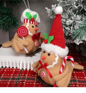 Detail of Christmas bird felt hanging ornaments featuring Santa hat and chef hat styles