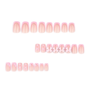 Pink French press-on nails with 3D bows and floral patterns in square-round shape